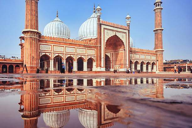 Jama Masjid Mosque in Delhi, india reflecting in water puddle